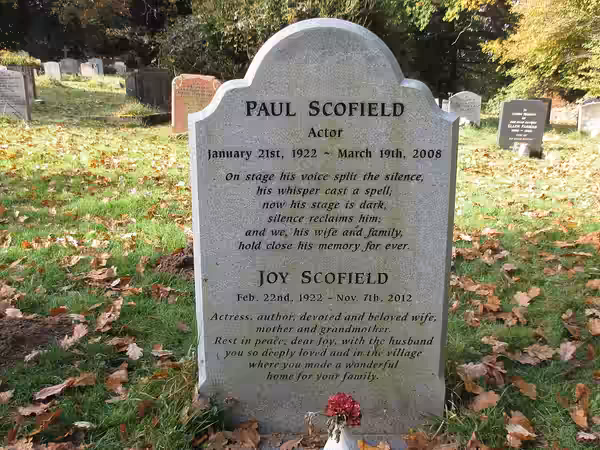 The gravestone of the actor Paul Scofield and his wife Joy in St. Mary's churchyard, Balcombe, West Sussex. (2016)