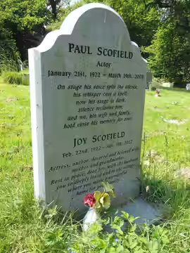 The gravestone of the actor Paul Scofield and his wife Joy in St. Mary's churchyard, Balcombe, West Sussex. (2016)