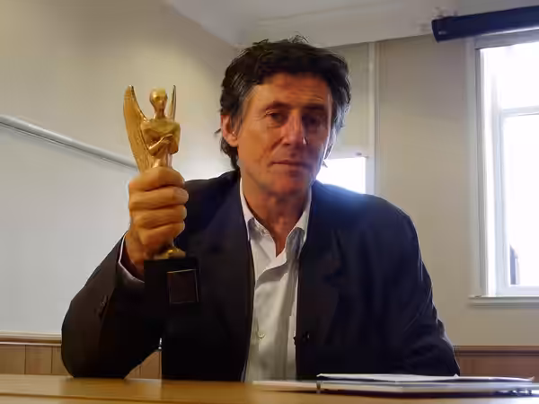 Irish actor Gabriel Byrne holding his Herald Angel, an award given to him at the 2006 Edinburgh festival.