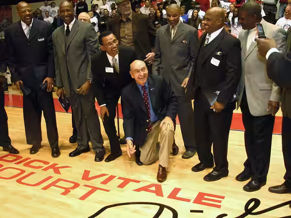 Dick Vitale unveils the logo dedicating the Calihan Court, University of Detroit Mercy, in his honor. L-R: Earl Cureton, Terry Tyler, Wilbur Ross, Dave Debussch (2011)