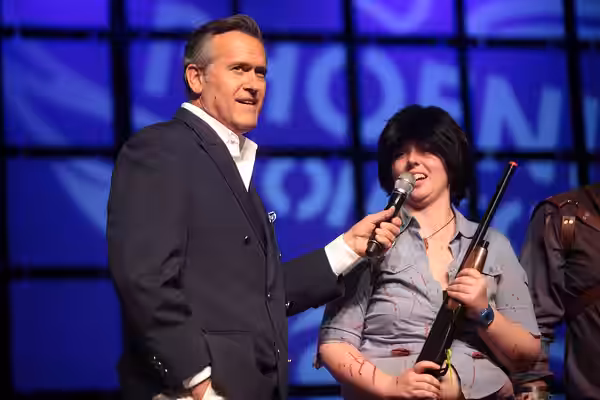Bruce Campbell speaking with an Ash Williams cosplayer at the 2014 Phoenix Comicon at the Phoenix Convention Center in Phoenix, Arizona. Please attribute to Gag