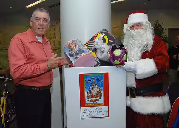 Former U.S. Marine Corps drill instructor turned Golden Globe-nominated actor R. Lee Ermey joins Santa Claus to put toys into the "Toys for Tots" donation box a (2008)