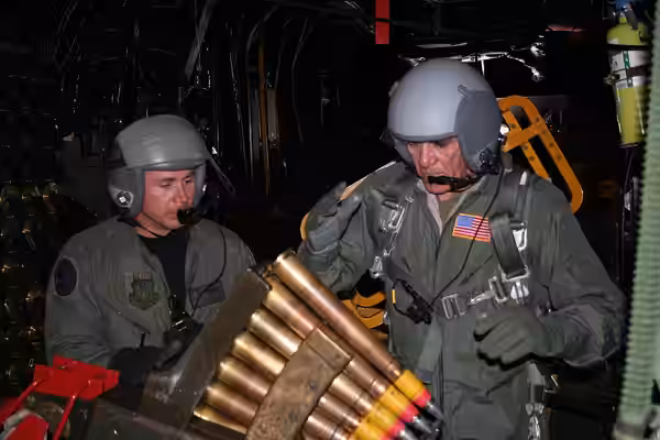 Master Sgt. Randy Scanian, 16th Special Operations Squadron (left), watches as the U.S. Marine Corps Gunnery Sgt. R. Lee Ermey (right), loads the 40mm gun of an (2008)