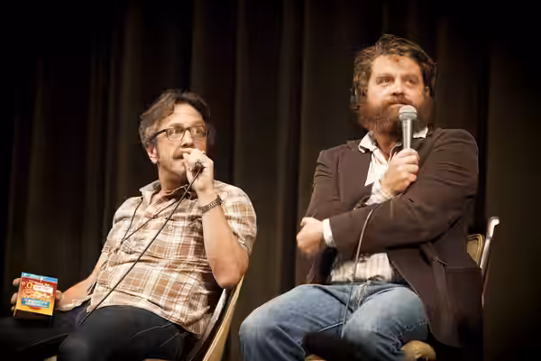 Marc Maron and Zach Galifianakis participating in a Doug Loves Movies podcast at the 2012 LA Pod Fest