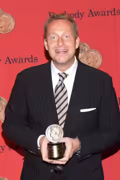 Adam Price with a Peabody Award for the television show "Borgen" (2014)