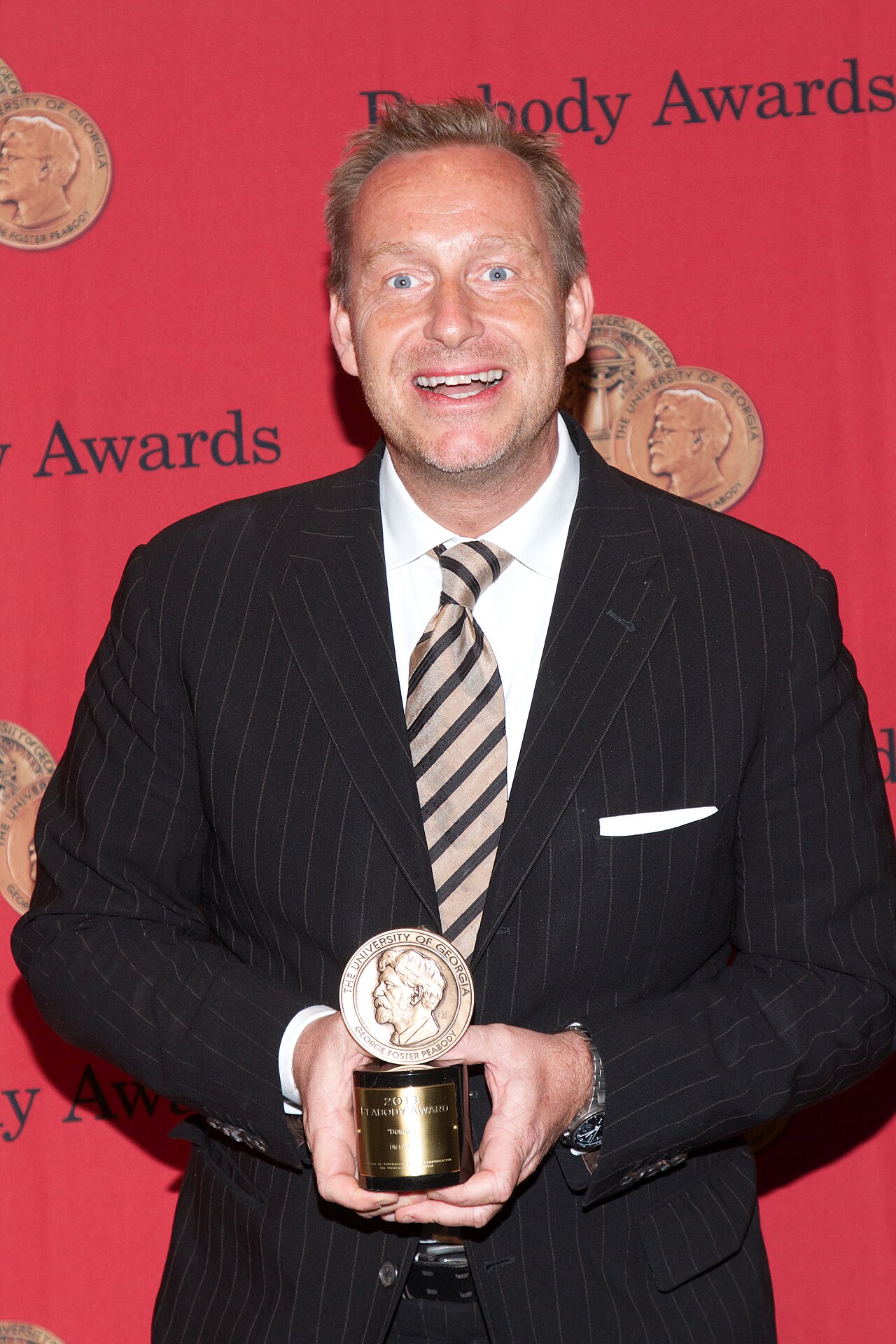 Adam Price with a Peabody Award for the television show "Borgen" (2014)
