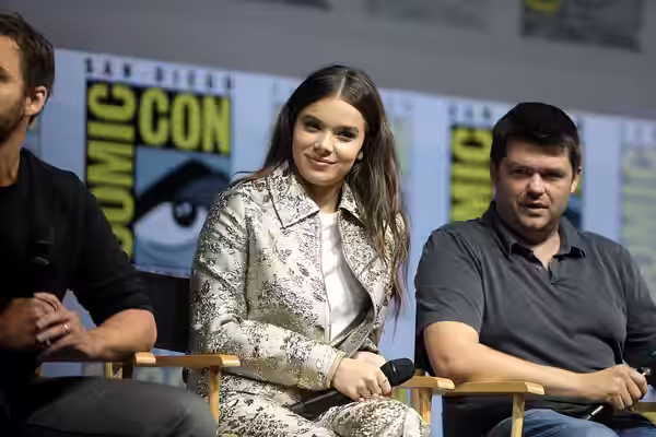 Hailee Steinfeld and Christopher Miller speaking at the 2018 San Diego Comic Con International, for "Spider-Man: Into the Spider-Verse", at the San Diego Conven