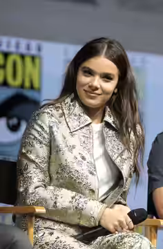 Hailee Steinfeld and Christopher Miller speaking at the 2018 San Diego Comic Con International, for "Spider-Man: Into the Spider-Verse", at the San Diego Conven