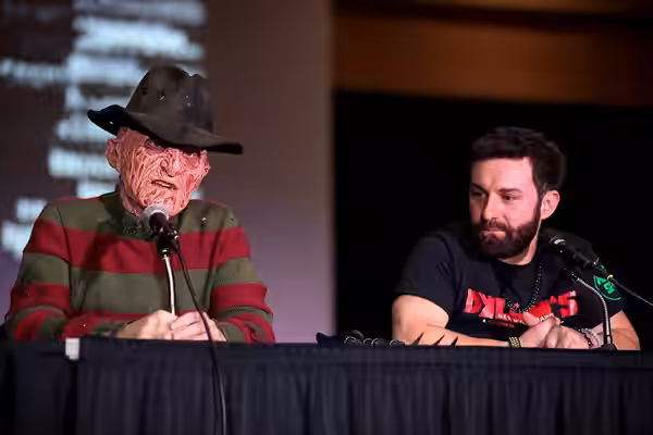 Dave McRae and Miko Hughes speaking with attendees at the 2023 Mad Monster Arizona Party at the Renaissance Phoenix Glendale Hotel &amp; Spa in Glendale, Arizon