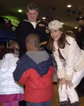 Kelly Preston; Norfolk, Va. (Dec. 3, 2005) - Actress Kelly Preston talks with Navy family members at the United Service Organization (USO) holiday party at Rock