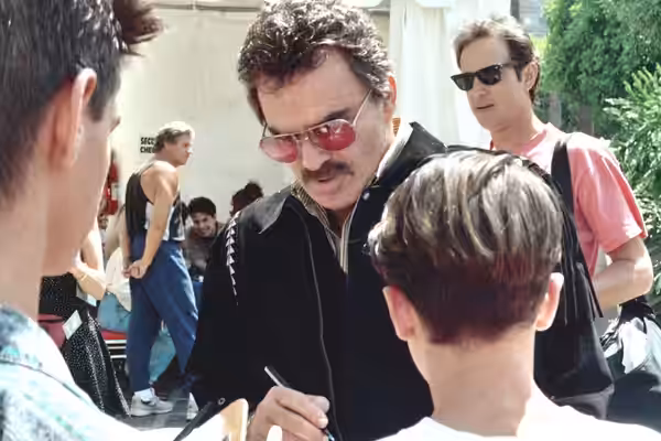 Burt Reynolds signing autographs at the 1992 Emmy Awards