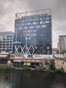 The remains of the Mark Addy pub, on the River Irswell, Manchester. or technically Salford. As viewed from the window of the People's History Museum. The bar wa (2023)