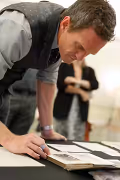 Neil Patrick Harris looks through a display of Harry Houdini Collection items in the Whittall Pavilion prior to the "National Book Festival Presents" series ope (2019)