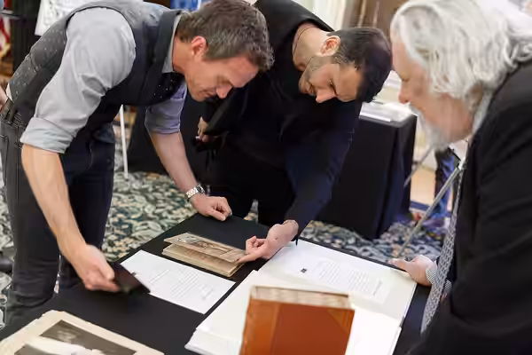 Neil Patrick Harris looks through a display of Harry Houdini Collection items with Rare Book and Special Collections Division Chief Mark Dimunation in the Whitt (2019)