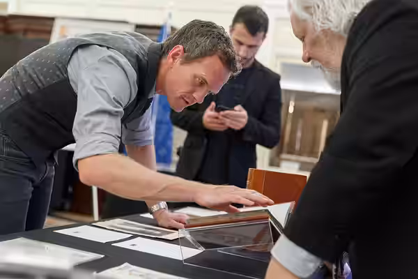 Neil Patrick Harris looks through a display of Harry Houdini Collection items with Rare Book and Special Collections Division Chief Mark Dimunation in the Whitt (2019)
