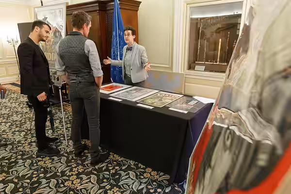 Neil Patrick Harris looks through a display of Harry Houdini Collection items with Janice Grenci of the Prints and Photographs Division in the Whittall Pavilion (2019)