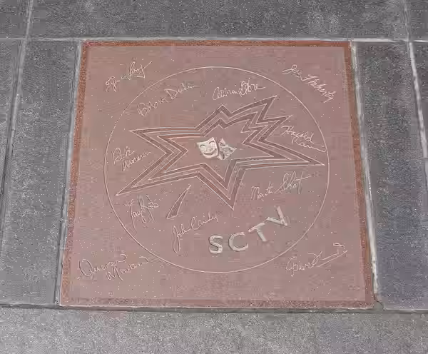 Star on Canada's Walk of Fame for the comedy troupe SCTV. Signatures in inner circle, clockwise from top left: Robin Duke, Catherine O'Hara, Harold Ramis, Marti (2009)