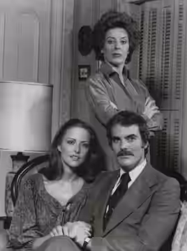 Denise Cavanaugh, played by Holland Taylor (standing) is a woman with a mission: to keep her husband, Miles (Joel Crothers), and the beautiful Nicole Drake (Jay (1978)