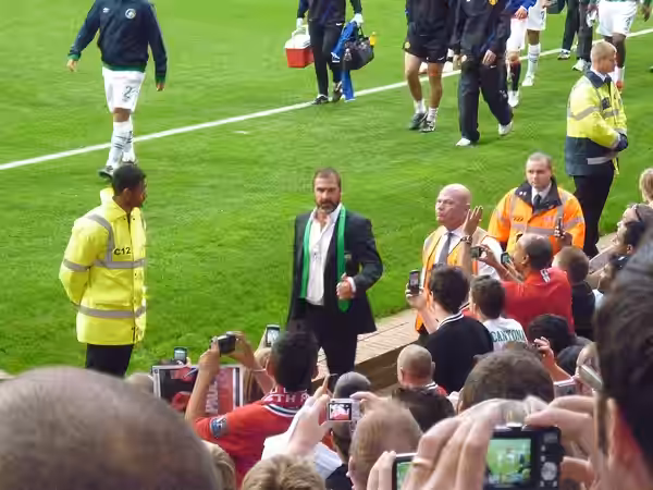 Eric Cantona, New York Cosmos director of soccer, at Old Trafford for his team's game against Manchester United for Paul Scholes's testimonial match (2011)