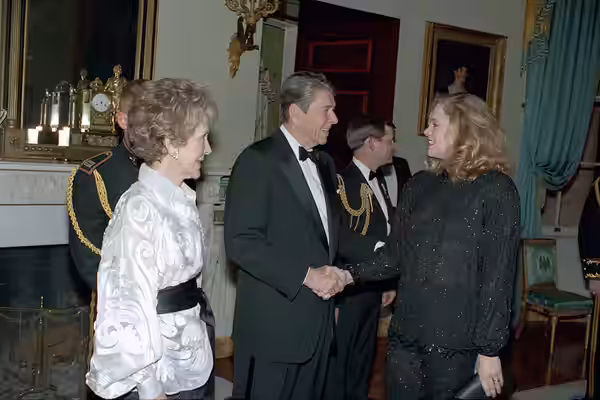 12-4-1988 President Reagan and Nancy Reagan greet actress Kathleen Turner at the Kennedy Center Honors reception in Blue Room