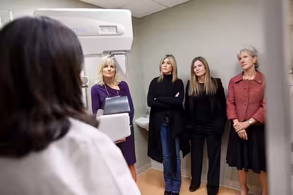 Dr. Jill Biden, along with Jennifer Aniston, Kristin Hahn, and Secretary of Health and Human Services Kathleen Sebelius, listens to Dr. Constanza Cocilovo durin (2011)