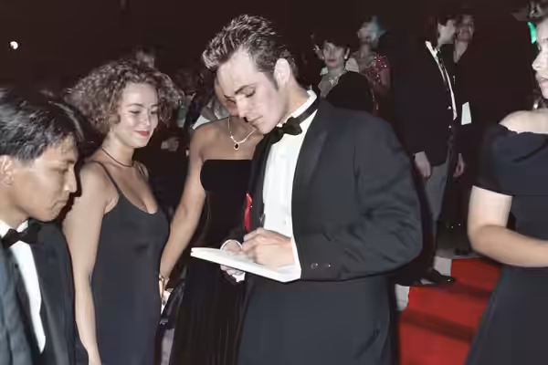 Luke Perry signs an autograph at the 1991 Emmy Awards. NOTE: Permission granted to copy, publish, broadcast or post any of my photos, but please credit "photo b