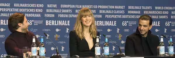 Press conference of 7 Days in Entnebbe at Berlinale 2018. Actors Daniel Brühl, Rosamund Pike, Omar Berdouni.