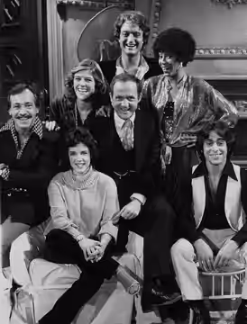 Stockard Channing (seated, front row left) as Susan Hughes, a newcomer to Los Angeles trying to make a new life, is surrounded by, counter-clock- wise, Albert I (1979)