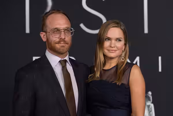 American actor Ethan Embry, left, with his wife Sunny Mabrey, arrives on the red carpet for the premiere of the film "First Man" at the Smithsonian National Air