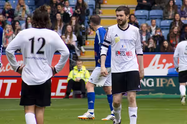 Harry Styles (number 12) and Jack Whitehall (facing camera) at a charity football game organised by Niall Horan (2014)