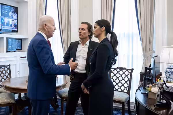 President Joe Biden speaks with actor Matthew McConaughey and his wife Camila Alves Tuesday, June 7, 2022, in the Press Secretary’s office at the White House. (