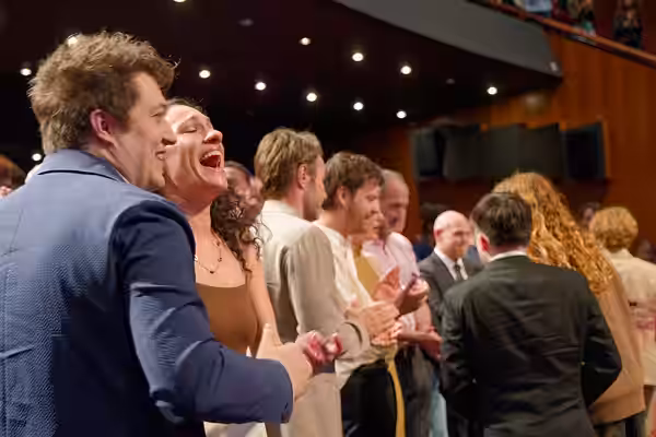 Cast and crew during the standing ovation at the 2025 Cannes Film Festival premiere of The Plague.