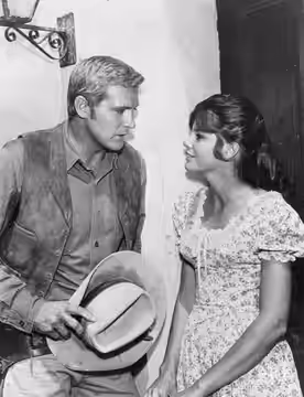 Photo of Lee Majors and Katharine Ross from the television series The Big Valley. (1965)