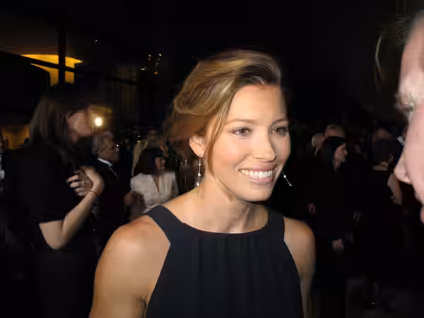 Giving interviews on the red carpet at the black tie gala. (2007)