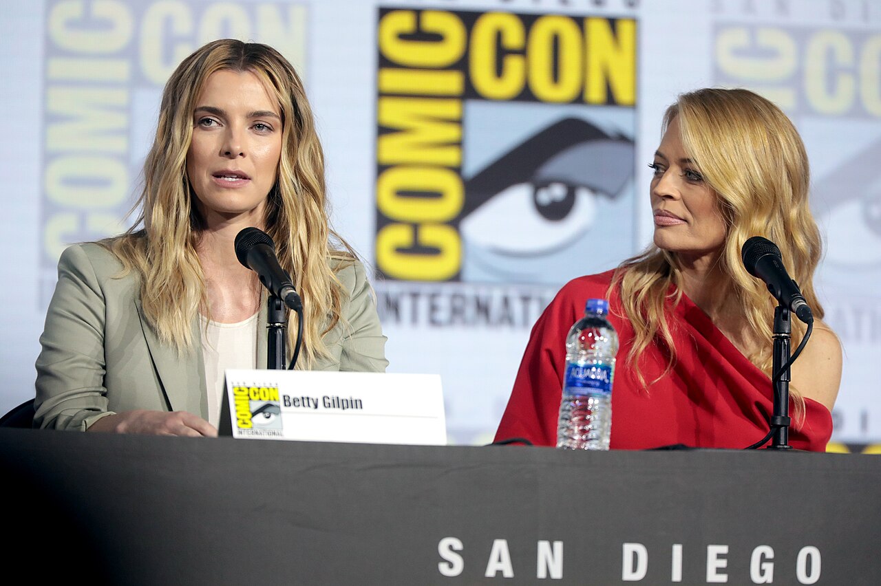 Betty Gilpin and Jeri Ryan speaking at the 2019 San Diego Comic Con International, for "Entertainment Weekly: Women Who Kick Ass", at the San Diego Convention C