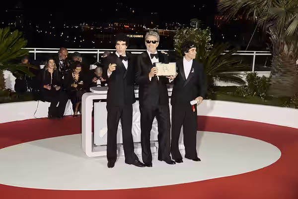 Javier Calvó, Paweł Pawlikowski and Javier Ambrossi pose with the ex-aequo Best Director award for "The Black Ball" and "Fatherland" during the Palme d'Or winne (2026)