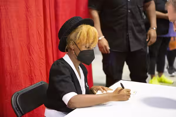 Janelle Monae signs books for fans at the National Book Festival, September 3, 2022. Photo by Elaina Finkelstein/Library of Congress. Note: Privacy and publicit