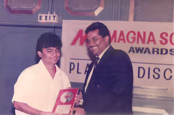 Shashi Gopal presenting a platinum disc to A.R.Rahman