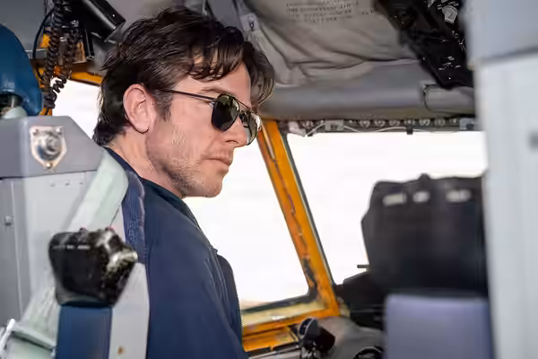 Comedian John Mulaney observes the flight controls aboard a KC-135 at Tinker Air Force Base, Oklahoma, Aug. 21, 2026. The visit gave Mulaney a firsthand look at