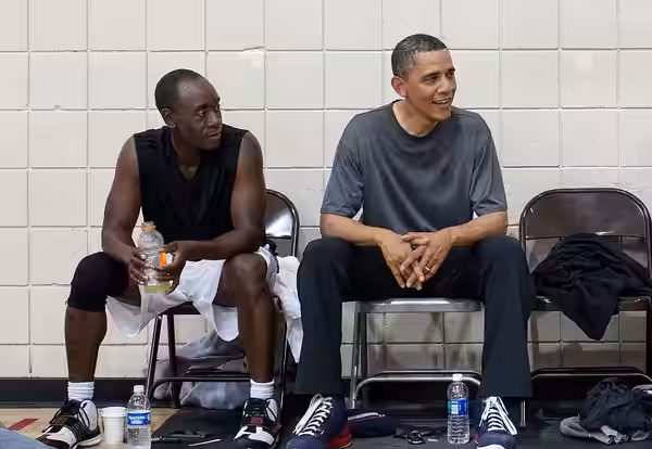 After some early morning basketball in Los Angeles, United States President Barack Obama talks with the players who included actors Don Cheadle, Tobey Maguire,  (2012)