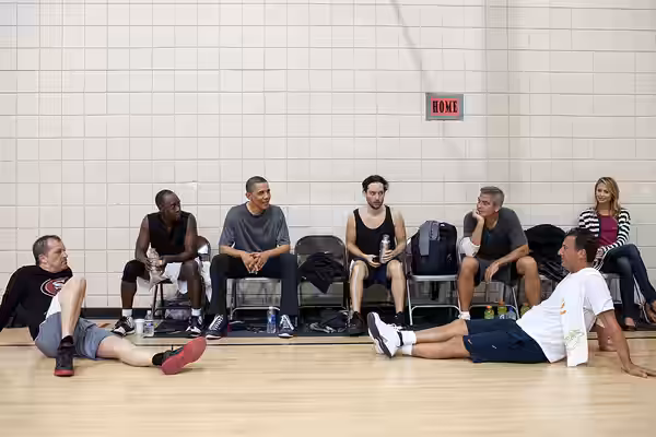 After some early morning basketball in Los Angeles, United States President Barack Obama talks with the players who included actors Don Cheadle, Tobey Maguire,  (2012)