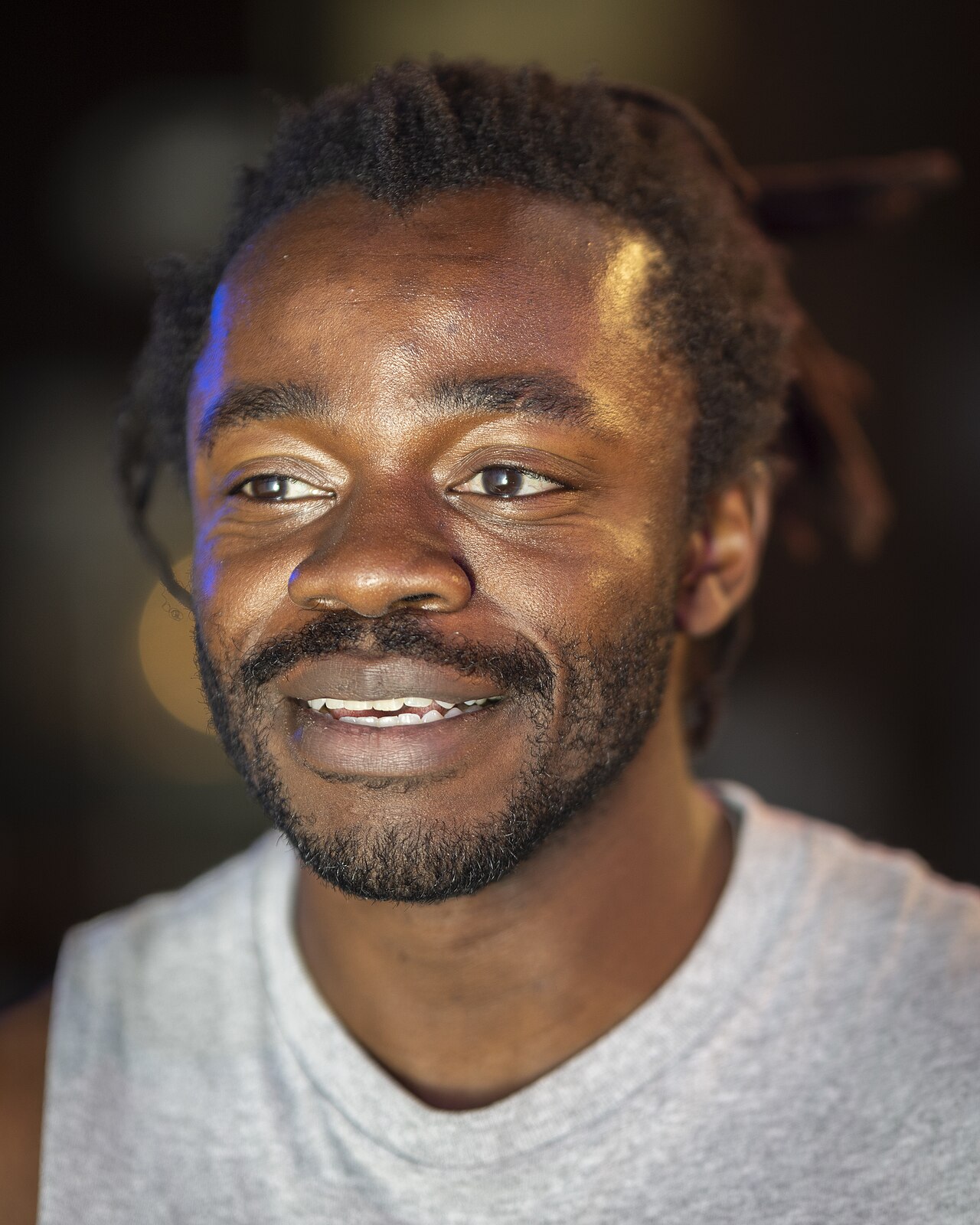 Photo of Demi Adejuyigbe onstage at Caveat, a comedy venue. (2025)
