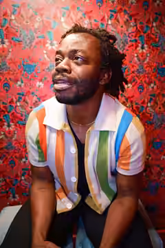 Demi Adejuyigbe photographed at Monkey Barrel Comedy during Edinburgh Festival Fringe 2026, by Philip Romano