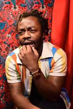 Demi Adejuyigbe photographed at Monkey Barrel Comedy during Edinburgh Festival Fringe 2026, by Philip Romano