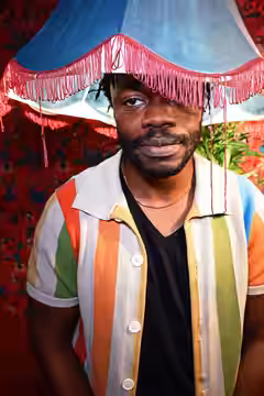 Demi Adejuyigbe photographed at Monkey Barrel Comedy during Edinburgh Festival Fringe 2026, by Philip Romano