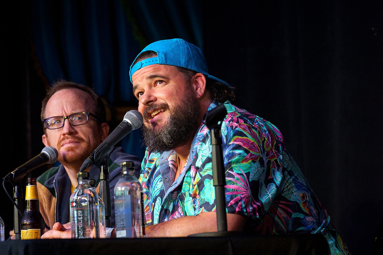 Jon Gabrus performs at improv4humans at SXSW 2024. Also pictured: Chris Gethard (left)
