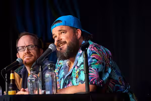Jon Gabrus performs at improv4humans at SXSW 2024. Also pictured: Chris Gethard (left)