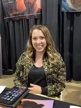 Mary Gibbs, the voice of Boo in Monsters, Inc., at her booth at Bakersfield Mouse-Con, January 30, 2022.