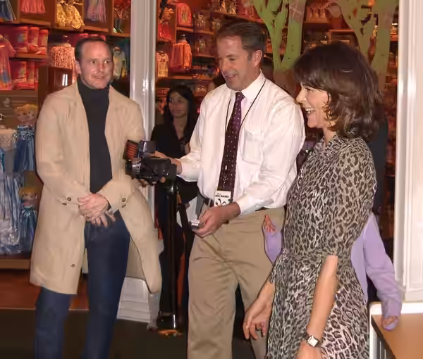 Actor Clark Gregg (left) and his wife, Dancing with the Stars personality Jennifer Grey (right), at the November 30, 2010 launch party for the Disney video game
