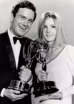 The actors Cliff Robertson and Melodie Johnson at Emmy Awards in 1966.